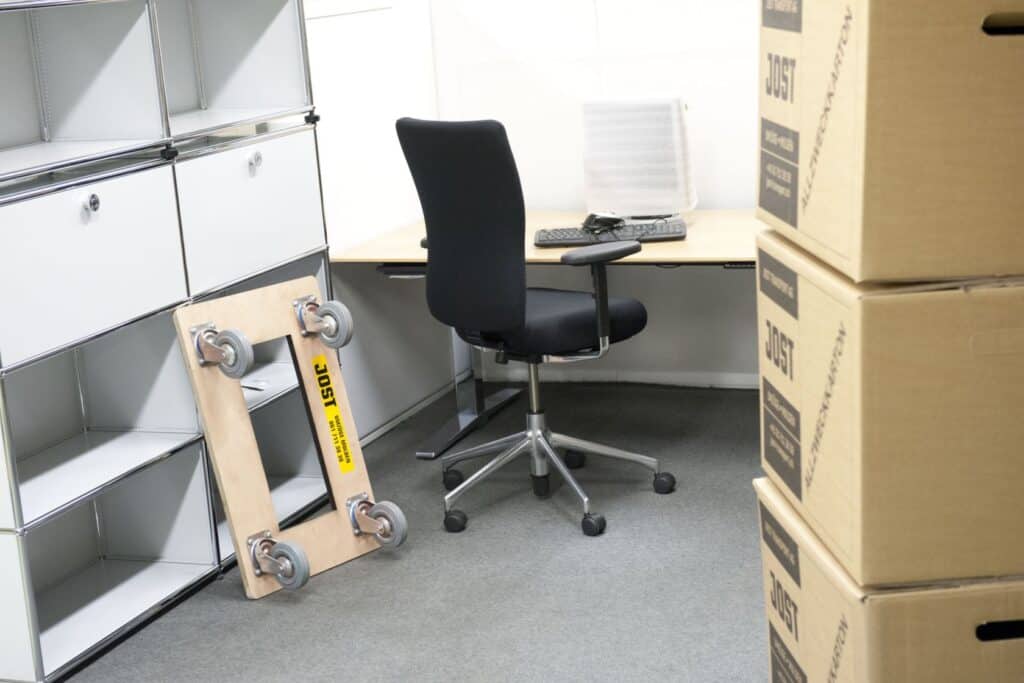 Office moving supplies, moving boxes and furniture, workspace organization, packing materials for office relocation, office relocation essentials.