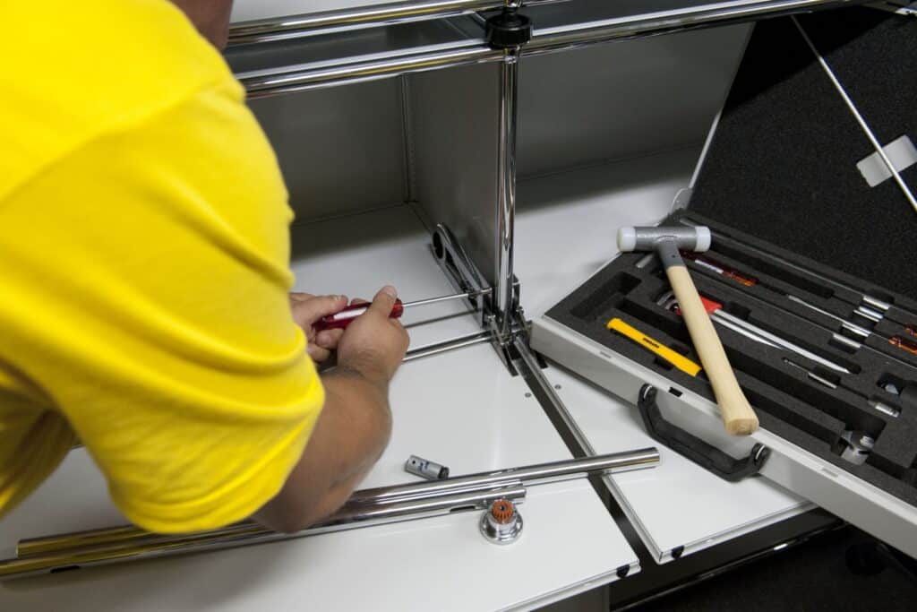 Precision furniture assembly with professional tools and techniques.