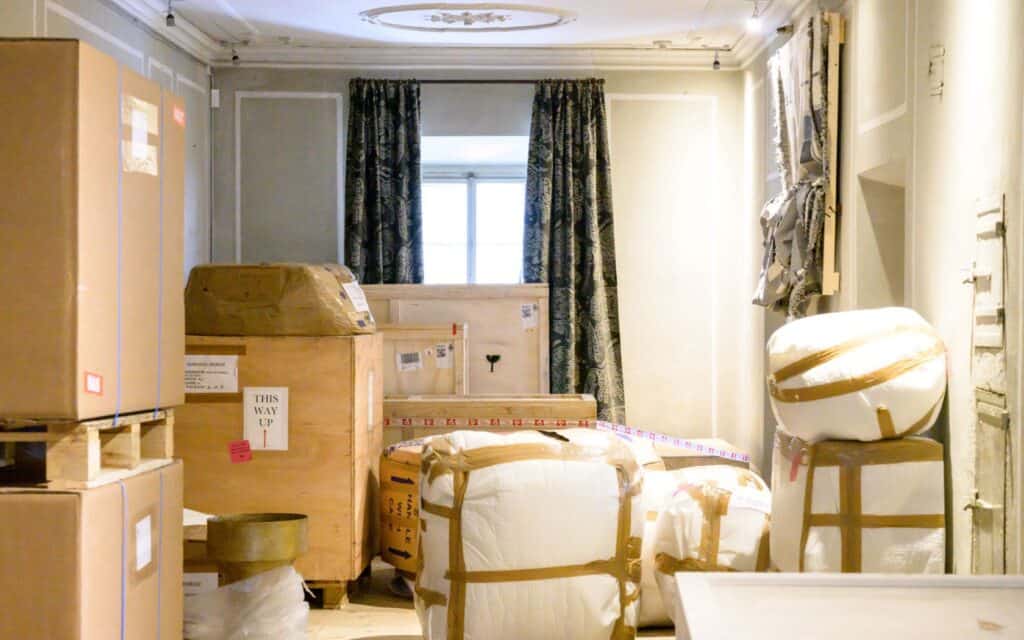 Newly packed moving boxes in a room preparing for relocation.